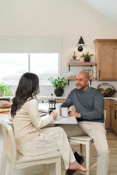 Elevon Frankfurt Couple Having Coffee in Kitchen Farmhouse Palette 6 Level